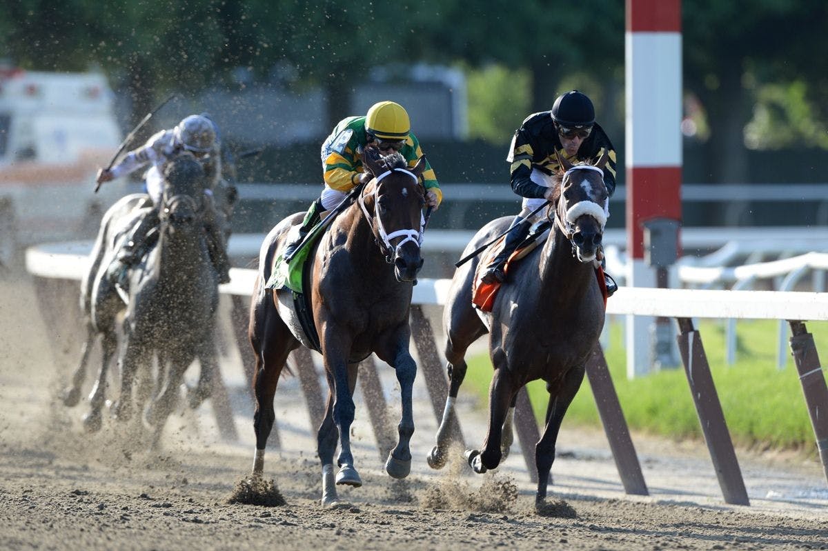 Palace Malice passes Oxbow in the 2013 Belmont Stakes (Photo by Joe Labozzetta/Coglianese Photos)