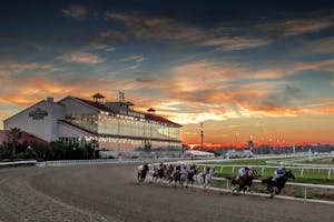 Fair Grounds racetrack grandstand racing scene sunset