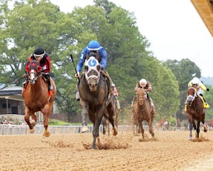 First Mission wins the Oaklawn Handicap at Oaklawn Park. 