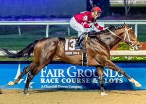 Magnitude wins the Risen Star at Fair Grounds. 