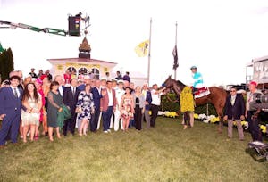 National Treasure and connections in the winner's circle of the Preakness Stakes