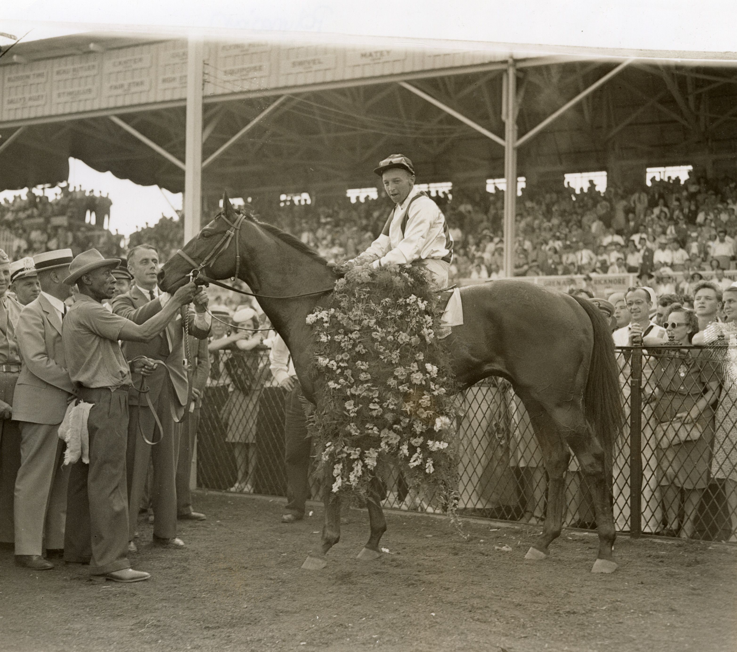 Polynesian with Jokey W D Wright wins the Preakness at Pimlico. 