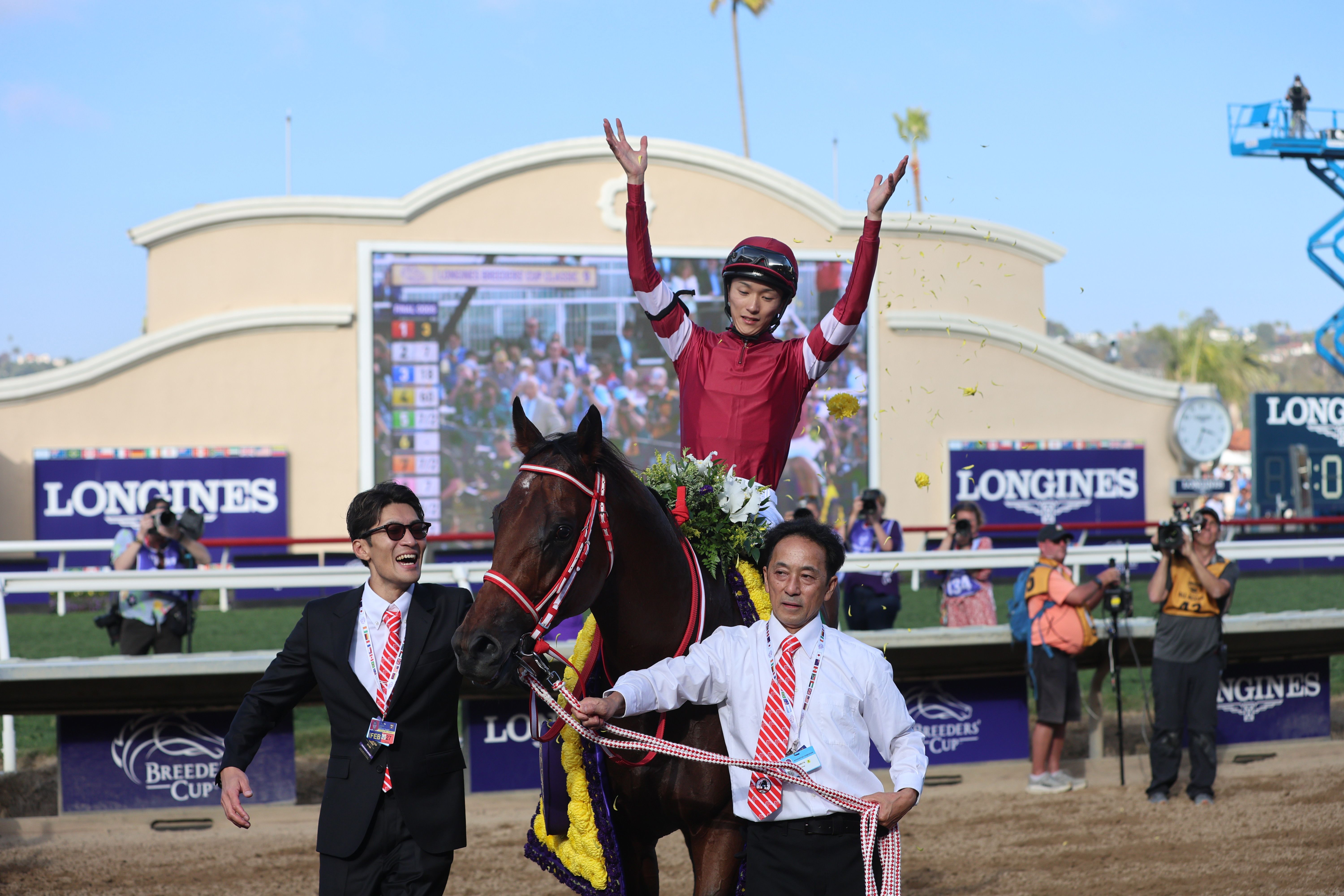 Forever Young's jockey, Ryusei Sakai, celebrates Japan's first Breeders' Cup Classic (G1) victory