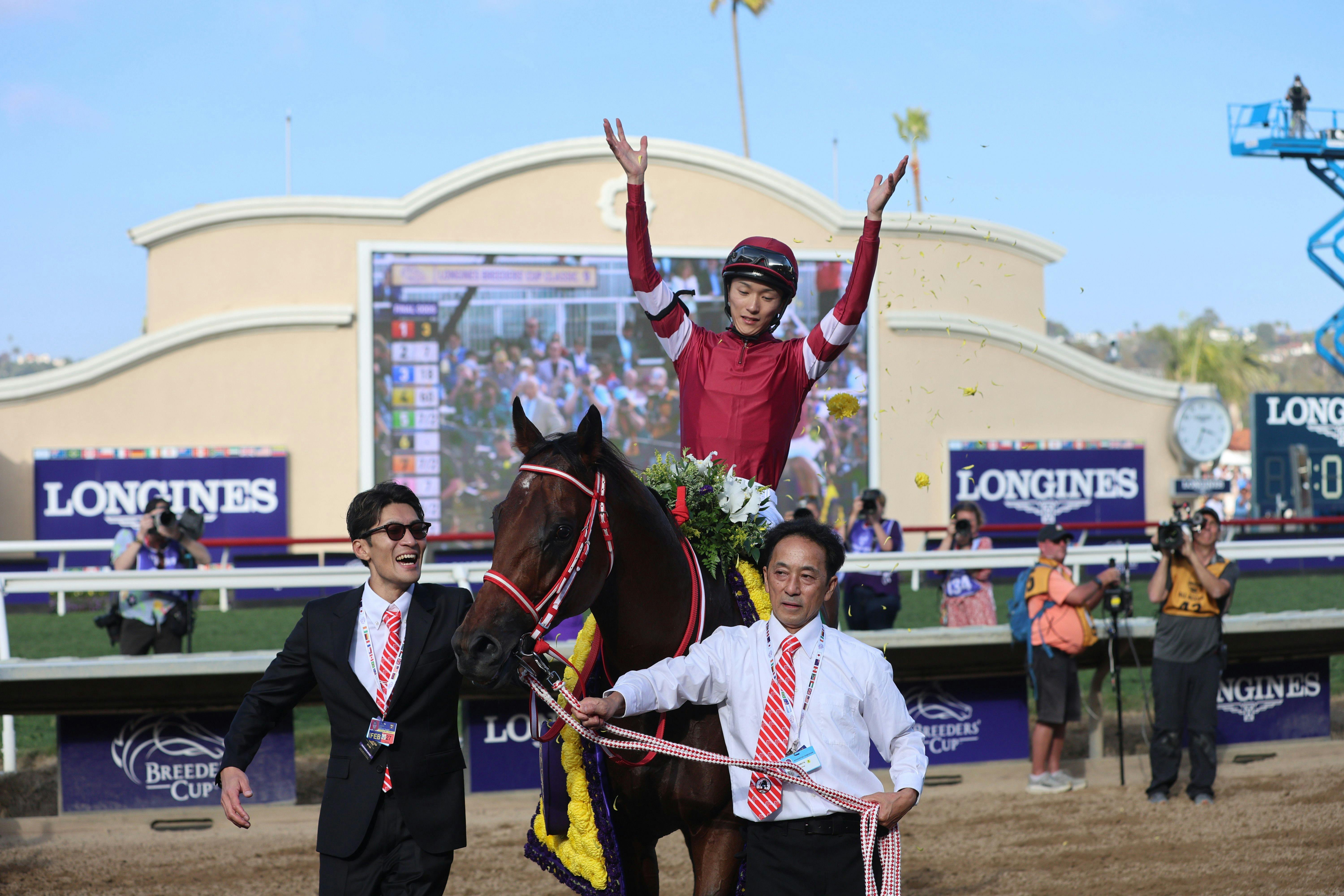 Forever Young's jockey, Ryusei Sakai, celebrates Japan's first Breeders' Cup Classic (G1) victory