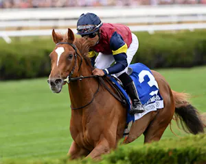 Kensington Lane winning the Belmont Oaks (G1) at Saratoga.